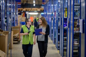 two warehouse workers in a warehouse