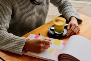 a person writing in a planner